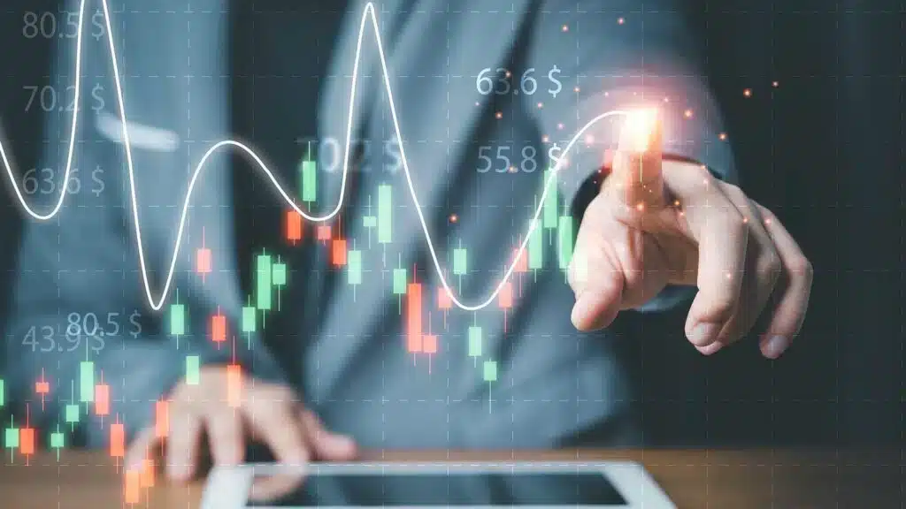 Trader analysant des graphiques de cotation CHF/EUR avec chandelier japonais et courbes de tendance sur écran tactile